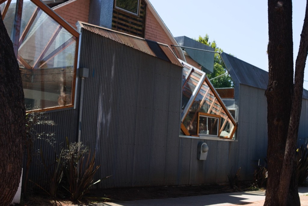 Contemporary metal-clad building with angular windows